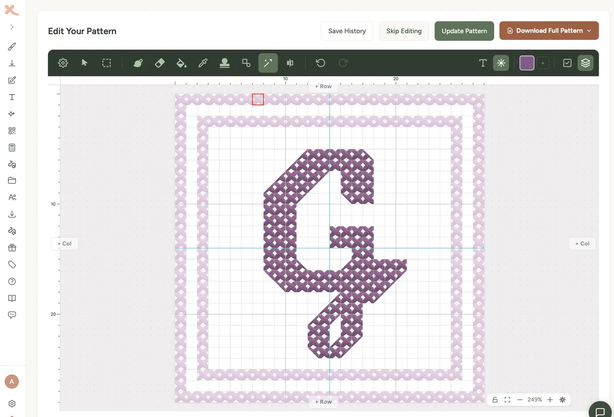 A single-initial cross stitch monogram designed in the Xstitchify pattern editor - a large decorative G in deep aubergine thread, framed by a square cream and pink flower border on a counted grid