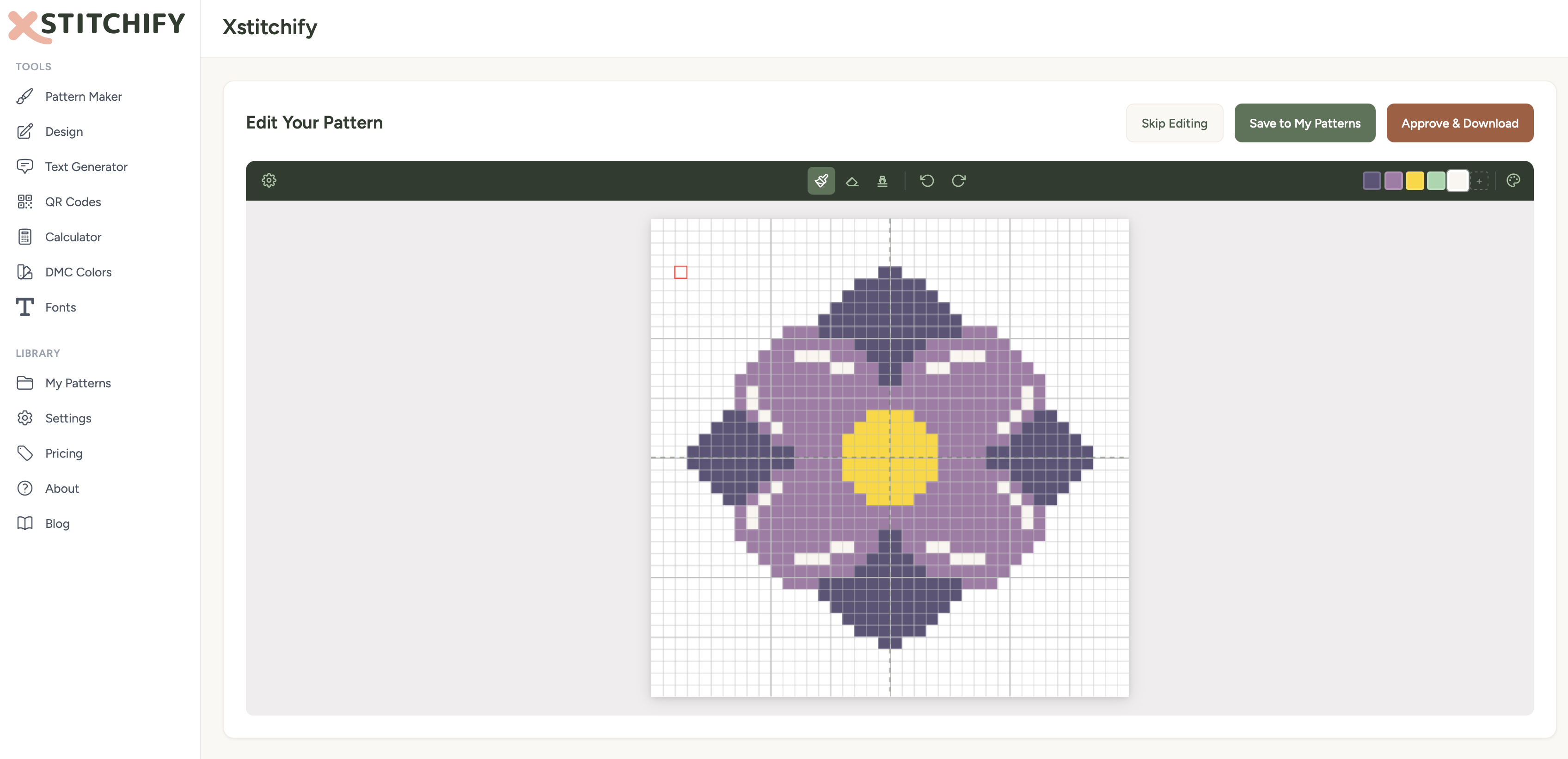 Pattern designer showing a hand-drawn symmetrical flower design on a pixel grid