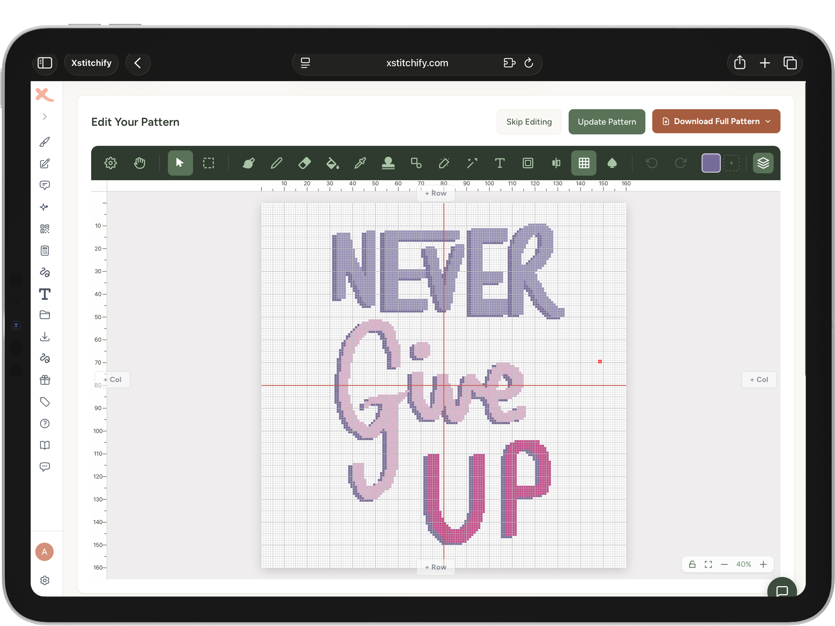 Cross stitch pattern with the words 'NEVER GIVE UP' hand-lettered in flowing purple-to-pink gradient cursive script on an iPad