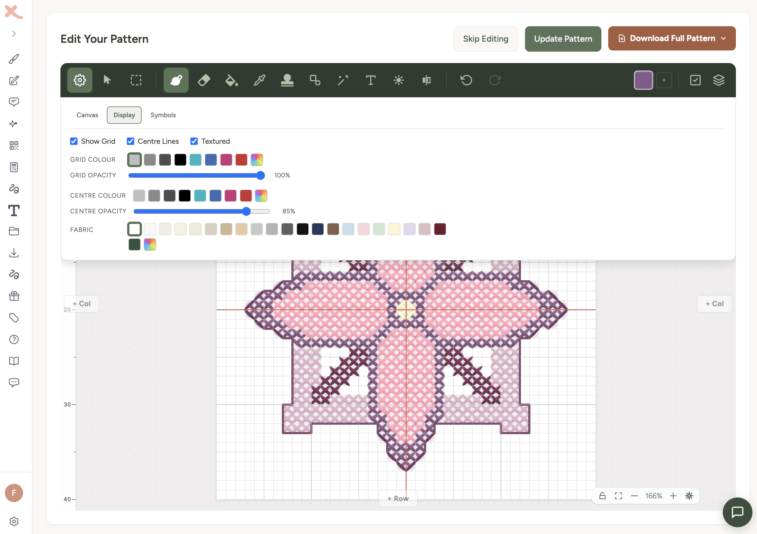 The settings panel open on the Display tab, showing grid, centre lines, textured view, and fabric colour options, with a textured cross stitch pattern below